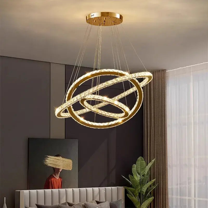 Gold-toned decorbites crystal chandelier pendant light with interlocking crystal rings for stair or living room lighting
