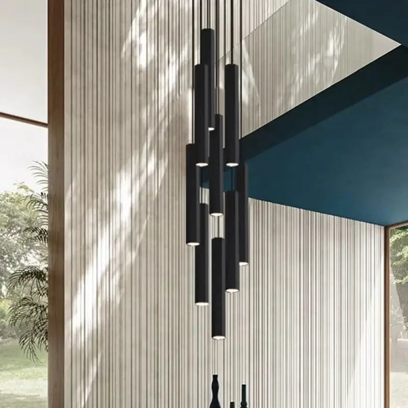 Modern black cylindrical pendant lamp with sleek minimalist design from decorbites crystal chandelier stair collection