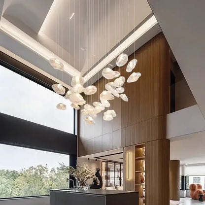Modern decorbites crystal chandelier stair pendant featuring translucent frosted glass orbs suspended by thin cables