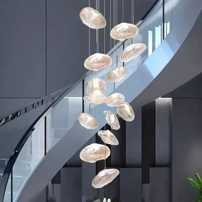 A modern DecorBites crystal chandelier stair pendant lamp with translucent glass orbs in a cascading design