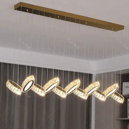 Gold-toned decorbites crystal chandelier with five interlocking crystal-encrusted circular lights for living room lighting