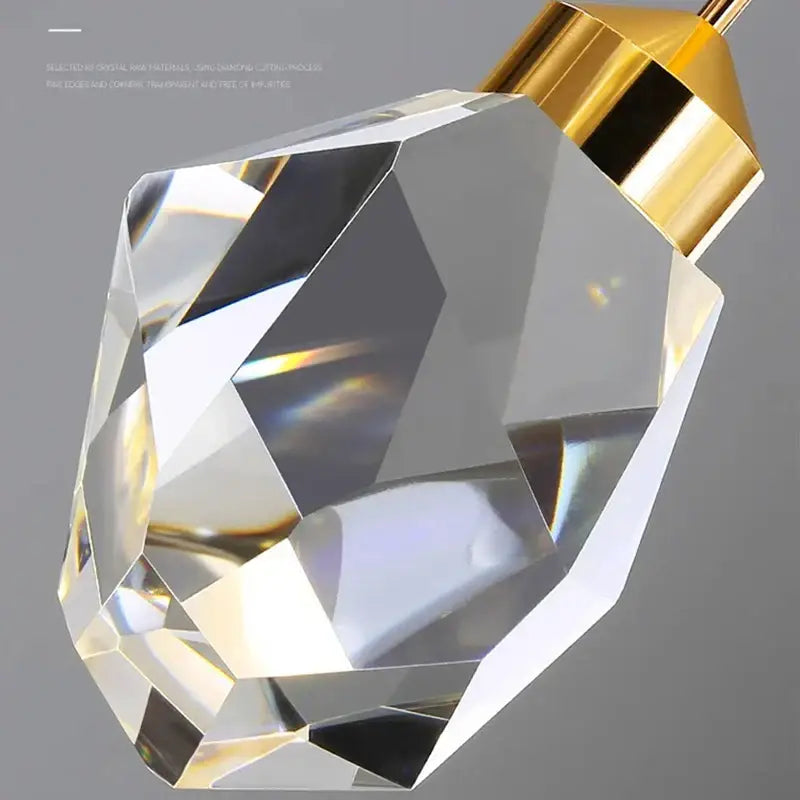 Faceted crystal pendant light with gold-toned metal cap from decorbites crystal chandelier for modern interiors