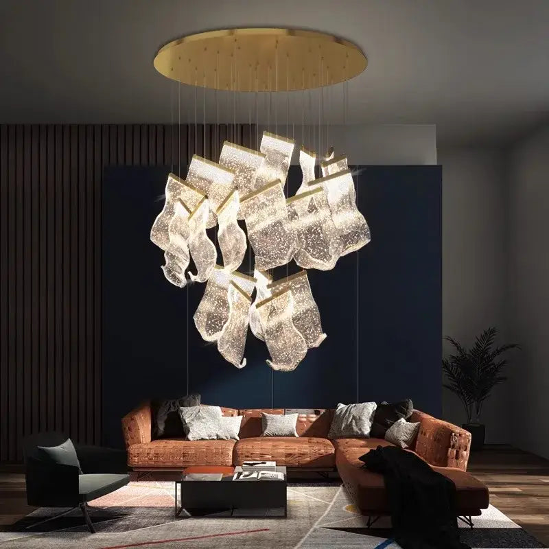 A modern gold-toned DecorBites crystal chandelier stair pendant light with translucent glass shades for living room lighting