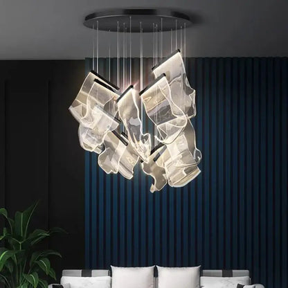 Decorbites crystal chandelier with modern acrylic pendant light featuring translucent panels emitting warm light for stair use