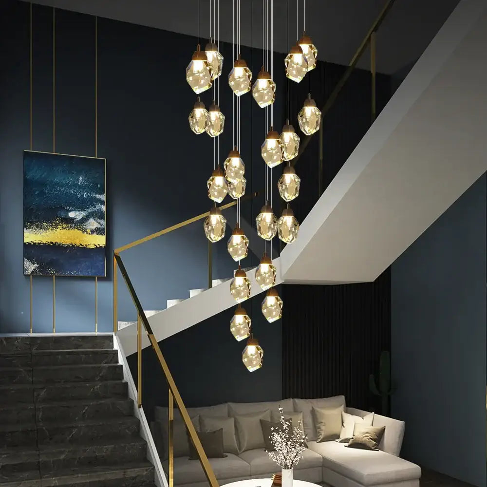 A modern decorbites crystal chandelier staircase pendant with faceted translucent glass LED lights for living room use