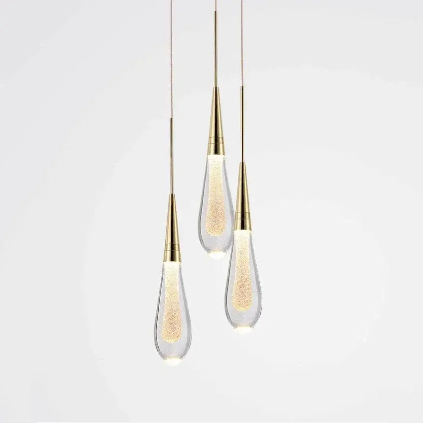 Three elegant decorbites crystal drop chandelier pendant lights with gold metal and clear glass for dining room use