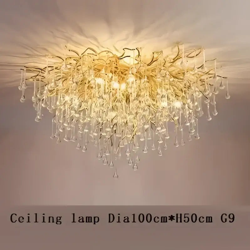 Golden Decorbites crystal drop chandelier with intricate branching arms and teardrop crystals for dining room lighting