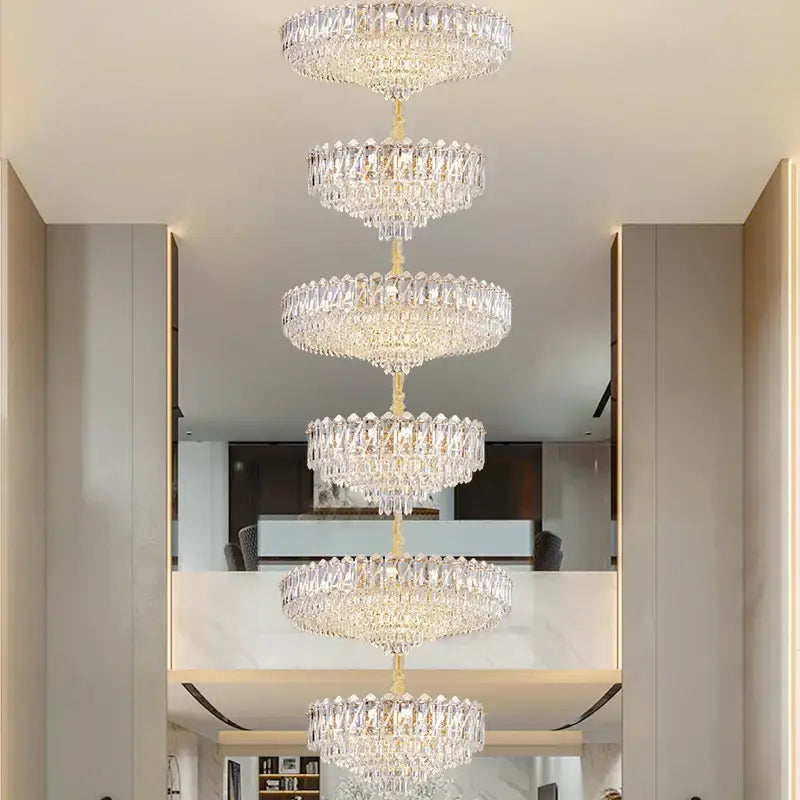A decorbites crystal duplex chandelier with a gold finish and clear faceted crystals for living room lighting
