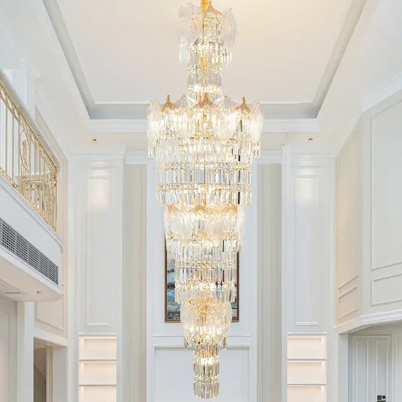 A multi-tiered decorbites crystal european long chandelier with gold-toned accents for living room lighting