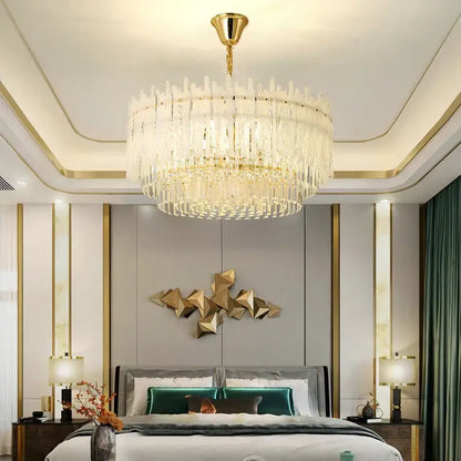 A decorbites crystal glaze gold chandelier with cascading clear crystal prisms for luxury dining room ceiling decor