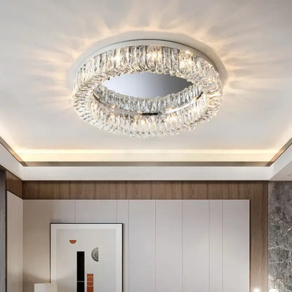 A decorbites crystal led chrome chandelier with faceted crystal rings and mirrored disc for modern living rooms