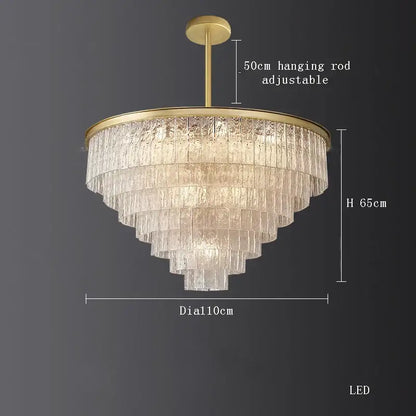 A decorbites crystal led chandelier with gold metal frame and cascading textured glass panels for dining room lighting