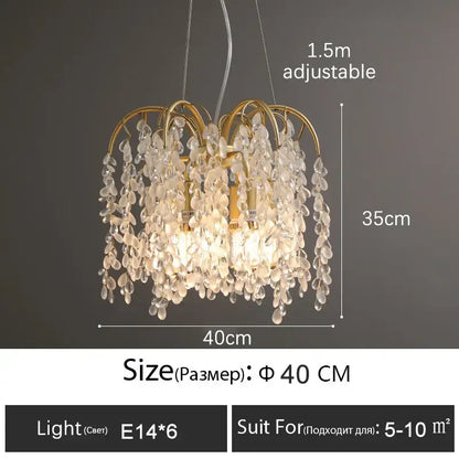 A delicate gold-toned decorbites crystal led chandelier with clear teardrop pendants for luxury living rooms