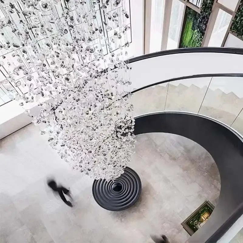 A dazzling decorbites crystal led chandelier with cascading tree-like glass design for luxury staircase lighting