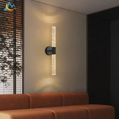 Modern black decorbites crystal led wall lamp with textured translucent glass cylinder emitting warm ambient light
