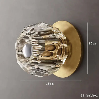 Clear crystal doorknob with faceted design and brass base complementing decorbites crystal led wall sconce decor