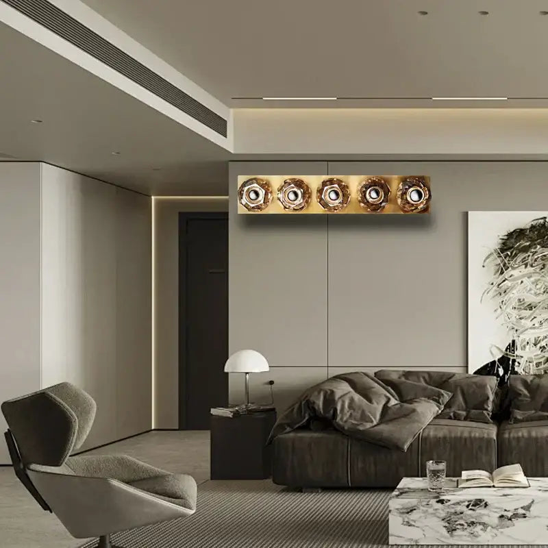 Gold-toned crystal led wall sconce with five ornate glass globes for modern luxury bedroom decor by decorbites