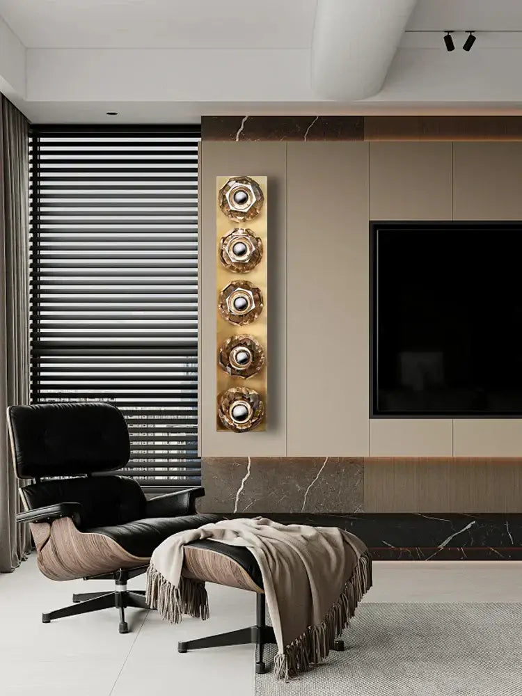 Black leather eames lounge chair with walnut wood frame and chrome legs next to modern luxury decorbites crystal led wall sconce