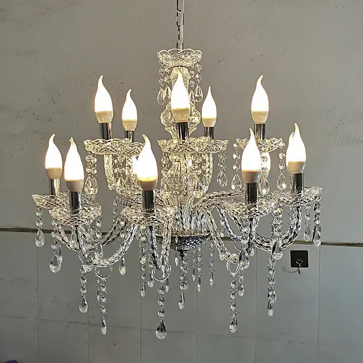 European style decorbites crystal light road pendant light featuring candle-style bulbs and dangling teardrop crystals