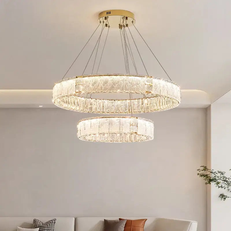 Modern gold double ring crystal living room chandelier with gold metal frames and cascading clear crystals from decorbites crystal living