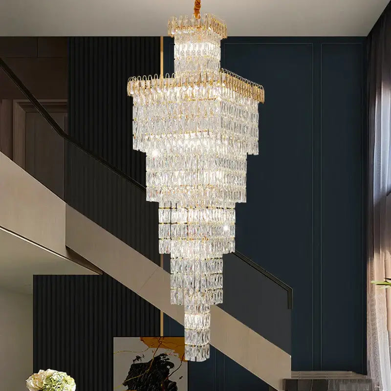 A modern gold crystal luxe living room chandelier with multi-tiered decorbites crystal luxe design for staircases