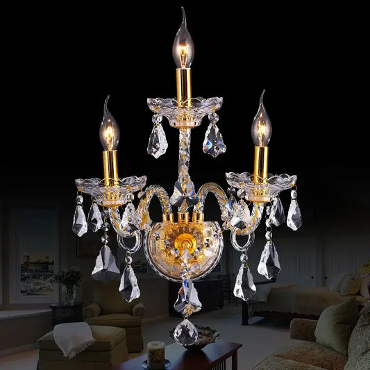 Luxury gold crystal wall lamp with dangling droplets designed for elegant luxury bedroom wall lighting