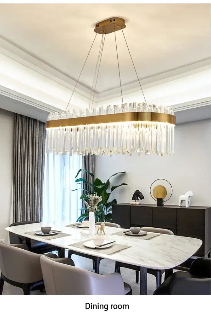 Gold-toned decorbites™ crystal pendant chandelier with cascading clear crystal prisms for luxury modest crystal home decor