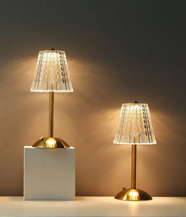 Two elegant brass decorbites crystal retro table lamps with faceted shades for a luxurious bedroom atmosphere