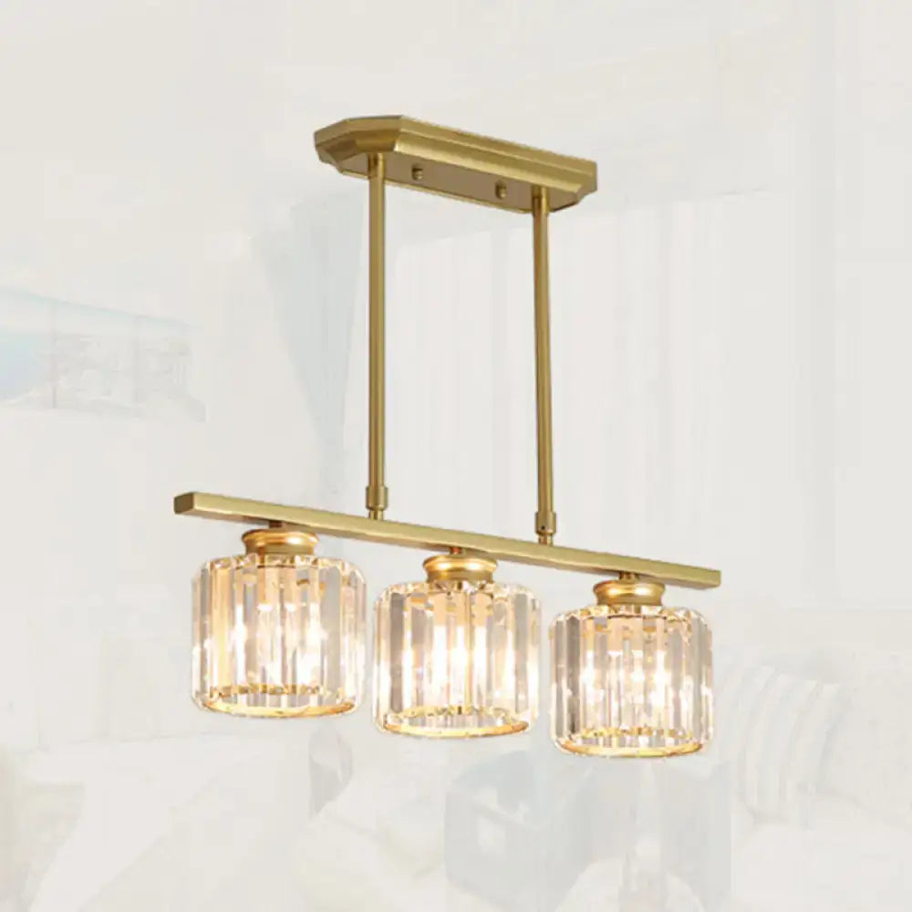 Gold-toned DecorBites crystal shade pendant light with three cylindrical glass shades for dining room island lighting