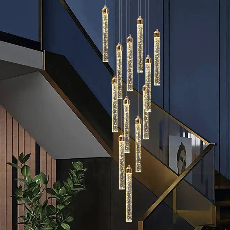 Golden cylindrical decorbites crystal staircase chandelier with sparkling internal led lights for modern interior use