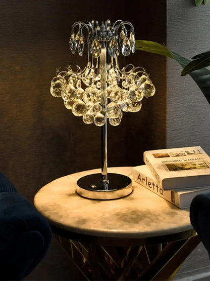 Elegant decorbites crystal table lamp with golden chandelier design and cascading teardrop crystals for bedroom lighting