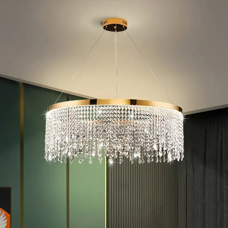 Decorbites crystal waterfall chandelier with gold-toned metal frame and clear crystal droplets for dining room lighting