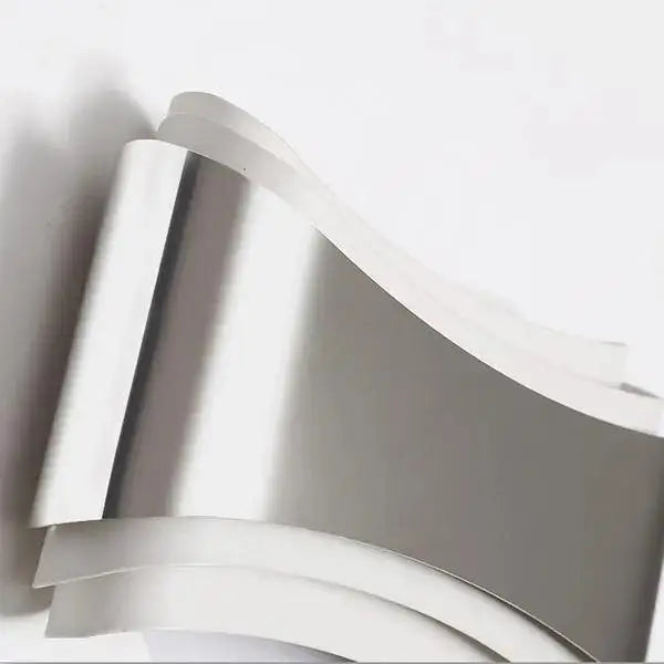 DecorBites curved modern wall sconce in stainless steel with sleek minimalist design and integrated LED lighting