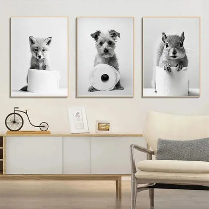 DecorBites™ cute animals canvas wall art features three black and white animal portraits on toilet paper rolls for bathroom decor