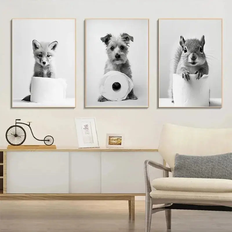 DecorBites™ cute animals canvas wall art features three black and white animal portraits on toilet paper rolls for bathroom decor