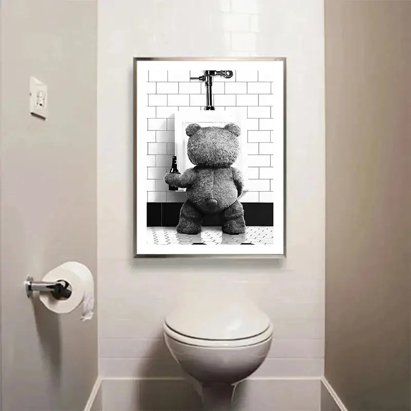 Black-and-white canvas print featuring a cute bear holding a bottle in front of a bear bathroom urinal by DecorBites