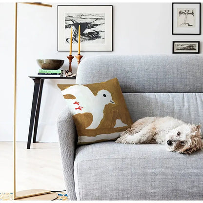 A cozy gray sofa with a decorbites cute dog printed black and white pillow cover featuring an embroidered bird design