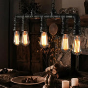 Industrial-style black iron pipe chandelier with five glowing filament bulbs compatible with 220v-240v and 110v-120v ceiling light use