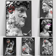 Black-and-white framed graffiti art canvas print featuring classical statues with vibrant color accents for room decor
