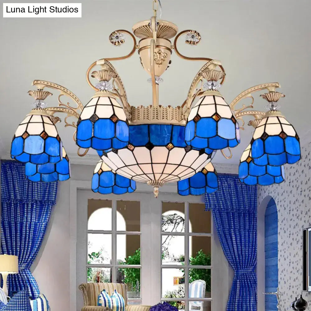 DecorBites dazzling Baroque light fixture featuring a blue and white stained glass chandelier with gold metal arms