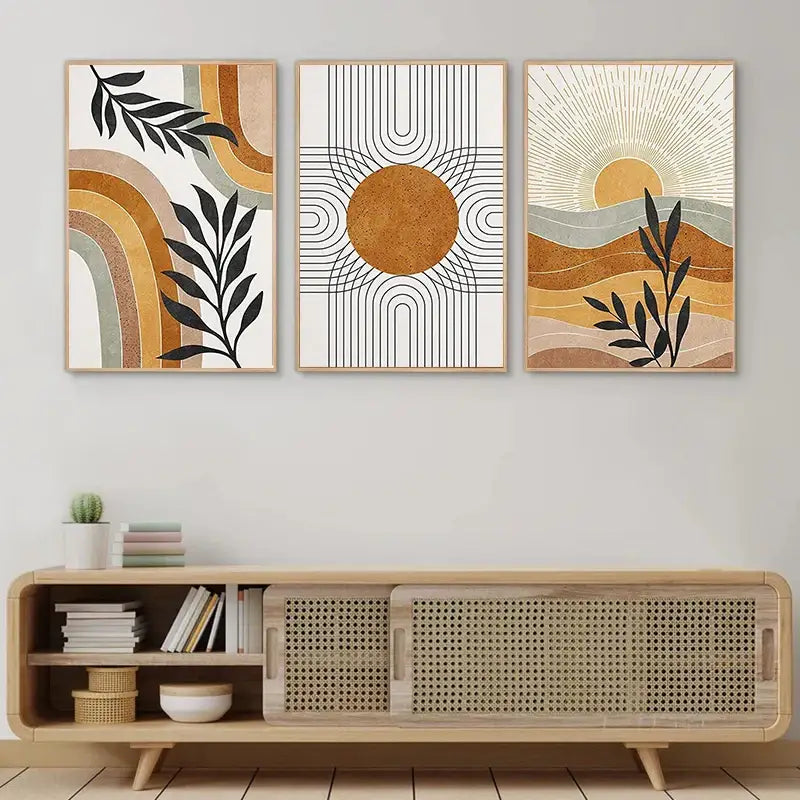 Three framed abstract wall art prints with geometric sun and desert plants motifs in beige ochre black and white colors