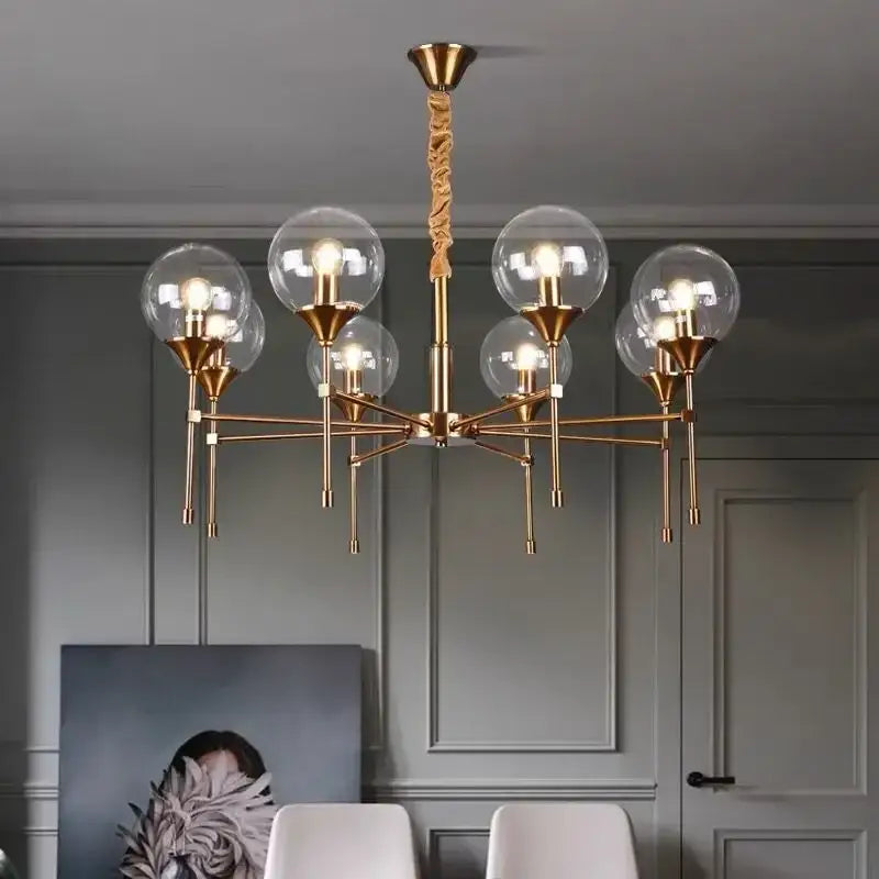 Brass-finished designer metal chandelier with six glass globes and twisted rope pendant for modern living