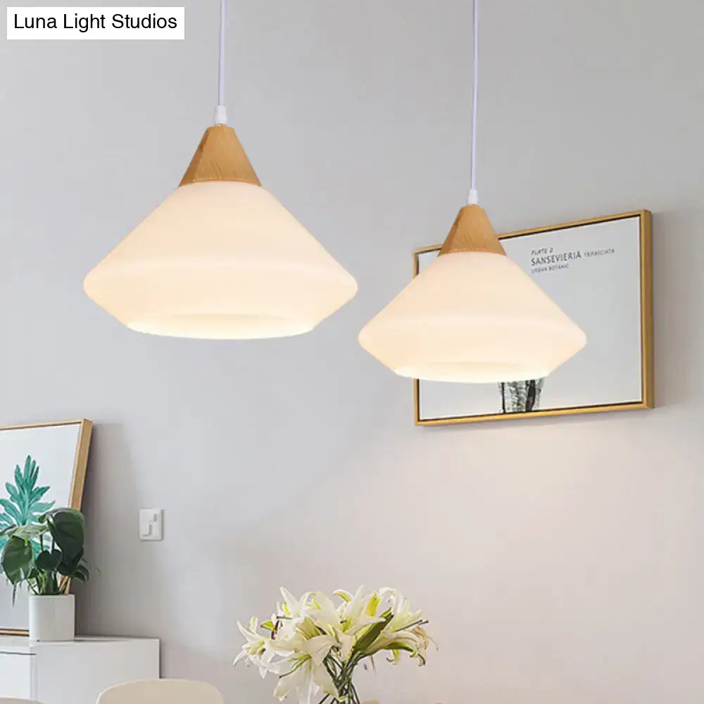 Modernist DecorBites™ diamond white glass pendant light with warm frosted shade and natural wood top for dining room use