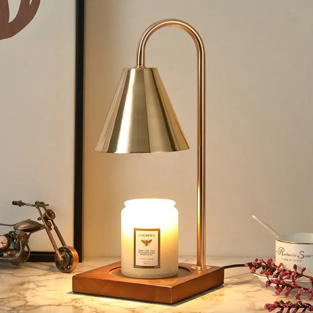 DecorBites dimmable candle warmer lamp with a gold-toned bell shape and curved metallic stand for warming candles