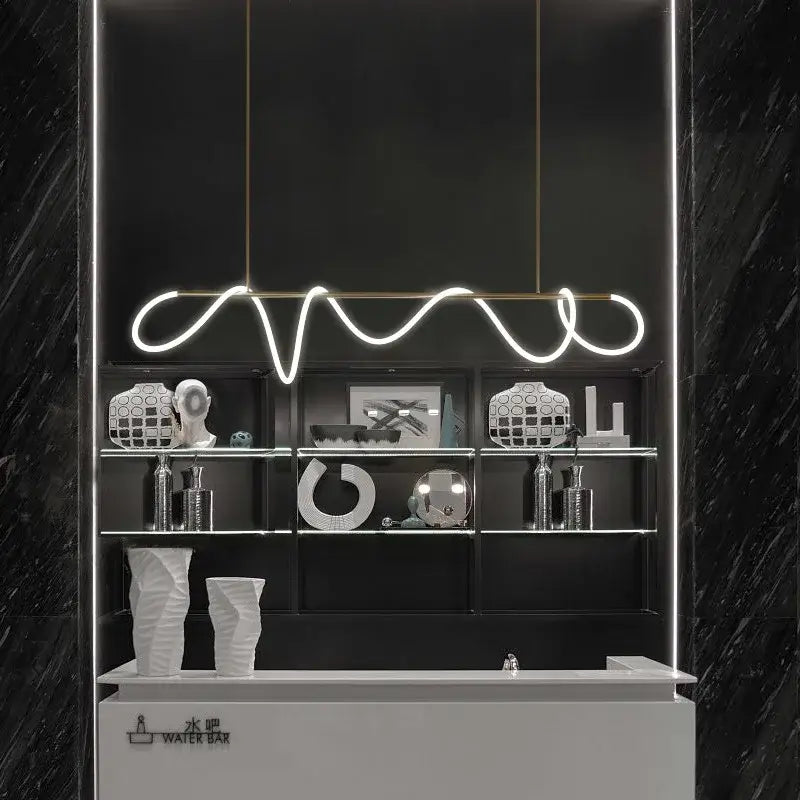 A sleek white decorbites™ dimmable nordic hose led ceiling chandelier with wavy design over black shelving unit for home decor