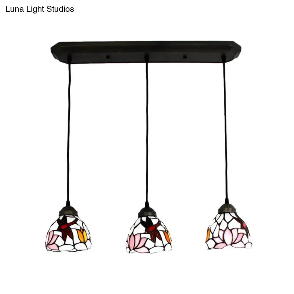Three pendant lights with pink lotus and red dragonfly art glass shades on black metal bar for 220v-240v led use