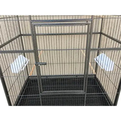 Black metal DecorBites™ dual breeding flight cage with solid door and two white perches for parrots
