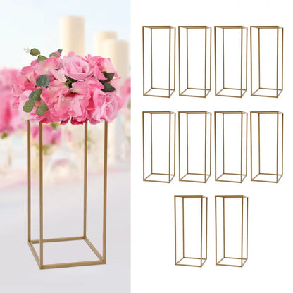 Gold-colored metal rectangular flower stand with minimalist geometric frame for elegant wedding flower display by DecorBites