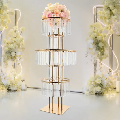 Gold-toned 5-tier wedding flower stand with clear crystal elements and a floral arrangement by DecorBites elegant flower stand