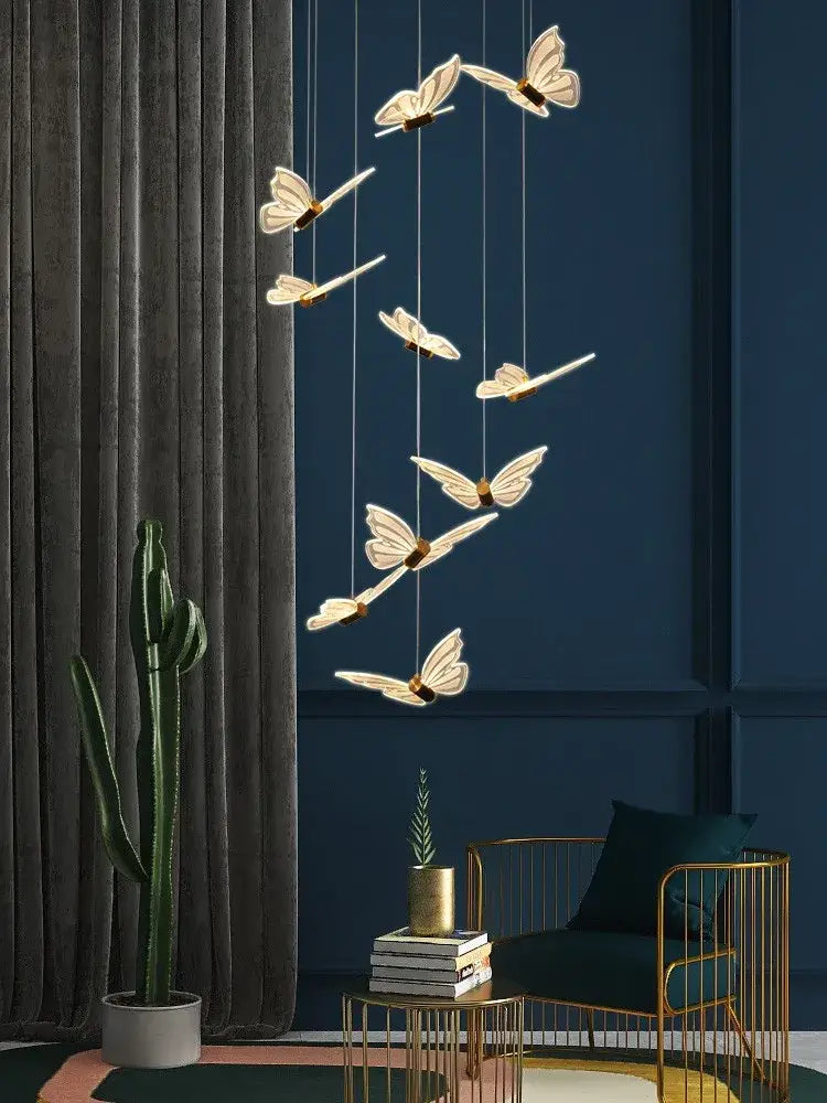Decorbites elegant butterfly chandelier featuring translucent white butterfly lights with gold centers for modern decor